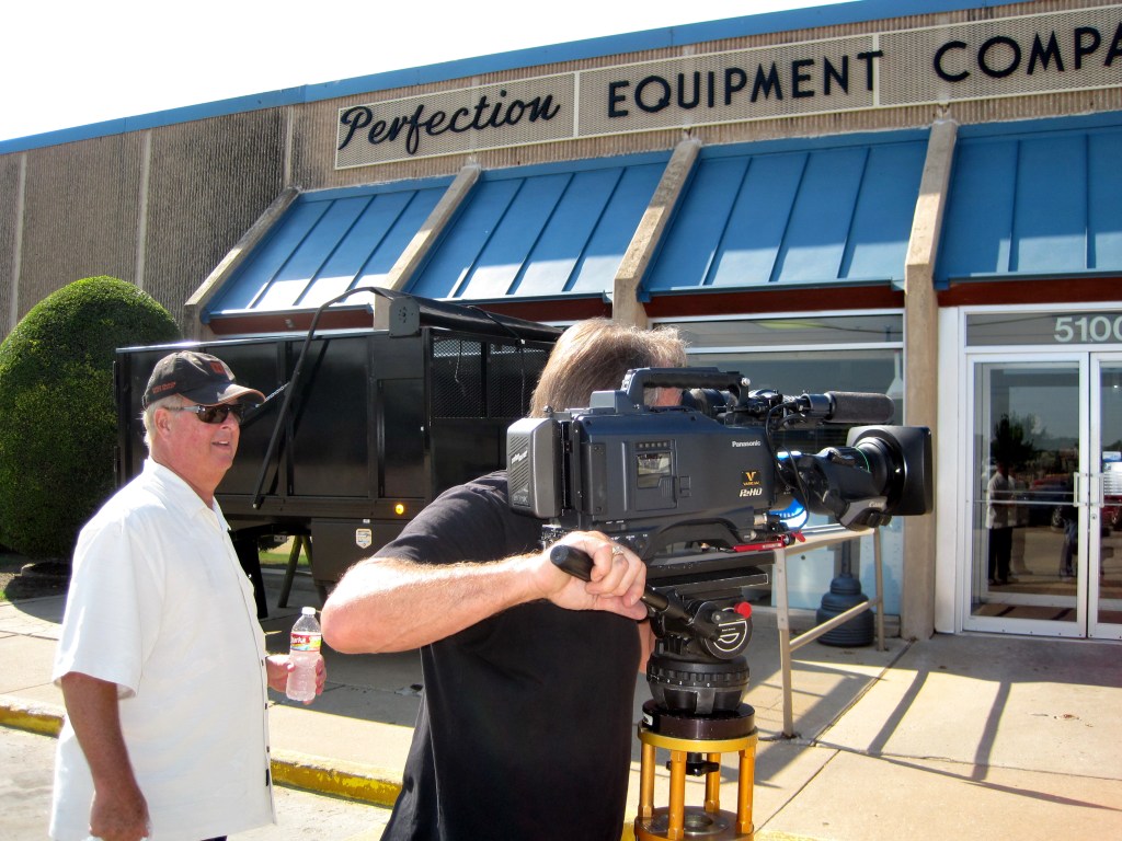 Video taping camera operator on location