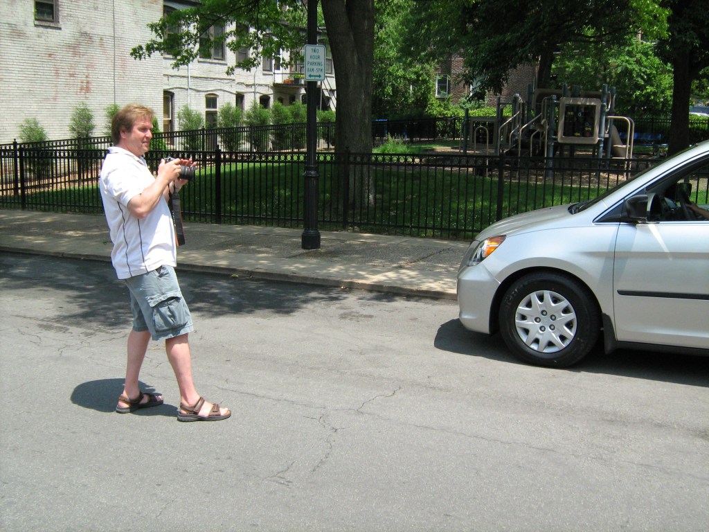 Producer setting up a shot for a corporate communications video.